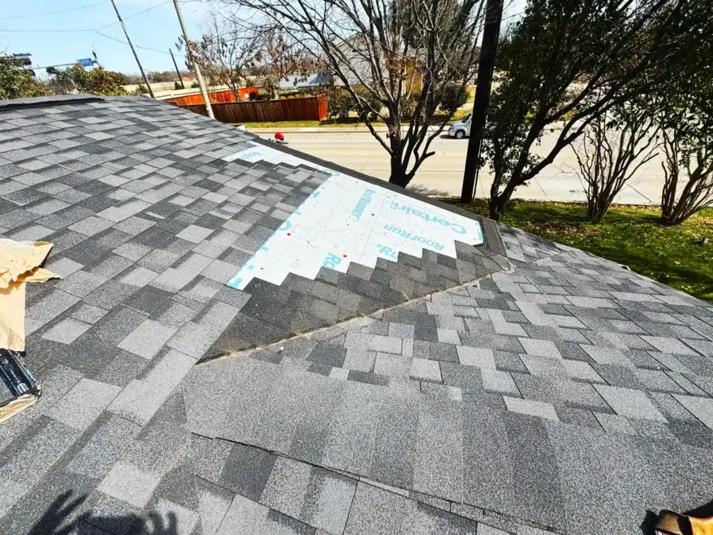Shingle roof repair in progress
