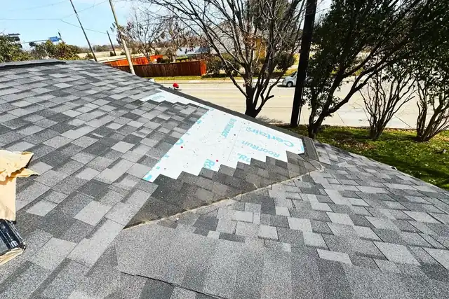 Shingle roof repair in progress