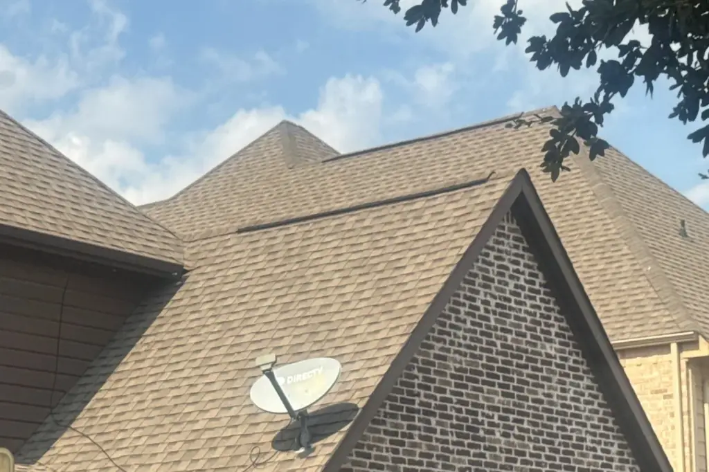 Asphalt shingle roof and brick gable on a two-storey home